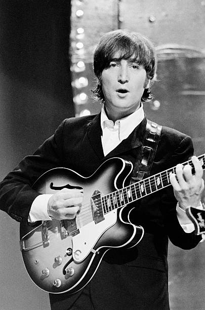 LONDON - 16th JUNE: John Lennon (1940-1980) from The Beatles performs 'Rain' and 'Paperback Writer' on BBC TV show 'Top Of The Pops' in London on 16th June 1966. (Photo by Mark and Colleen Hayward/Redferns)